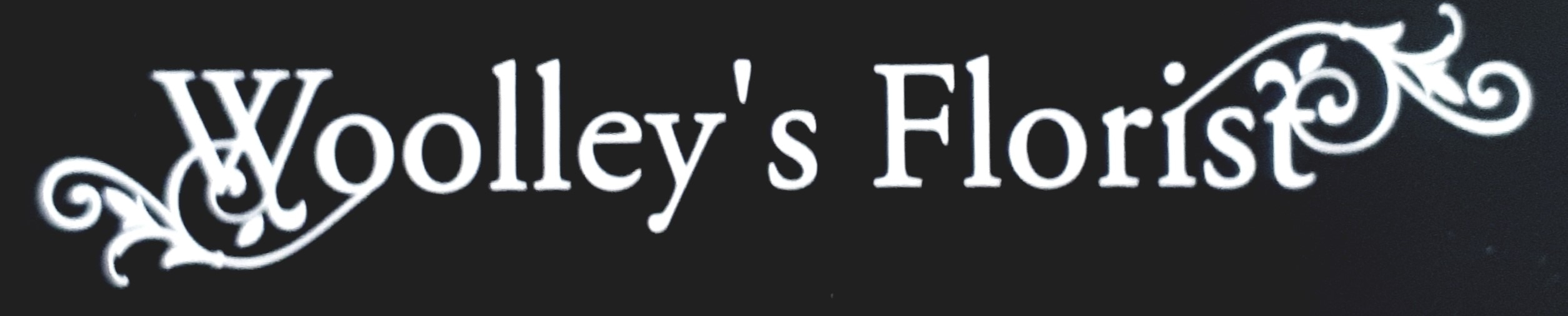 Woolley's Florist - Logo
