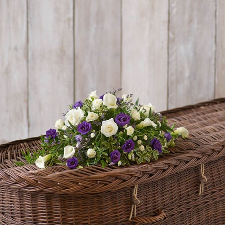 Petite Purple and White Casket Spray size,  inches height and  inches wide.