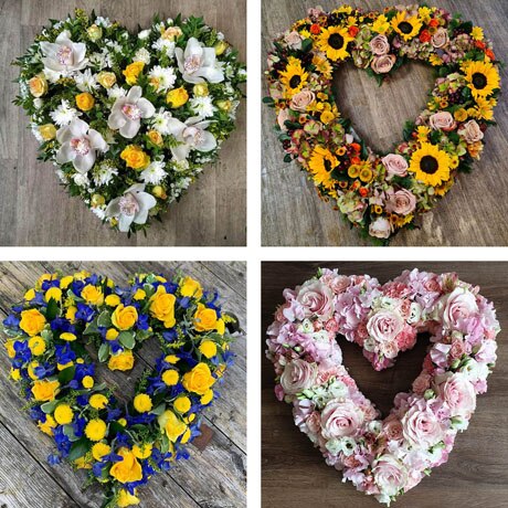 Funeral heart tribute made with the finest flowers Flower Arrangement
