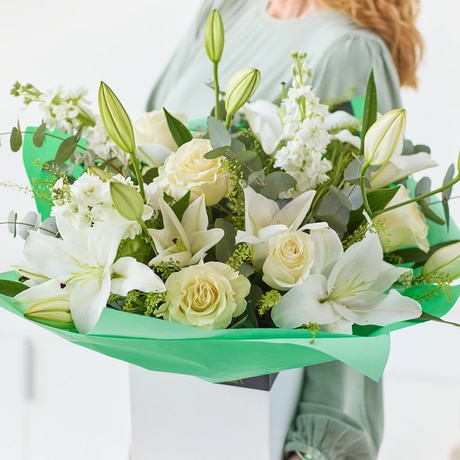 Sumptuous White Rose and Lily Bouquet size,  inches height and  inches wide.