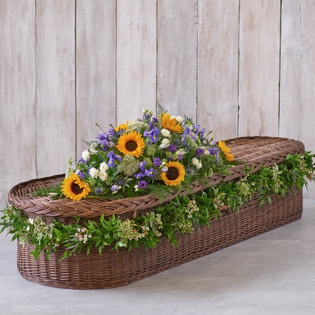 Sunflower Mix Casket Spray with Garland size,  inches height and  inches wide.