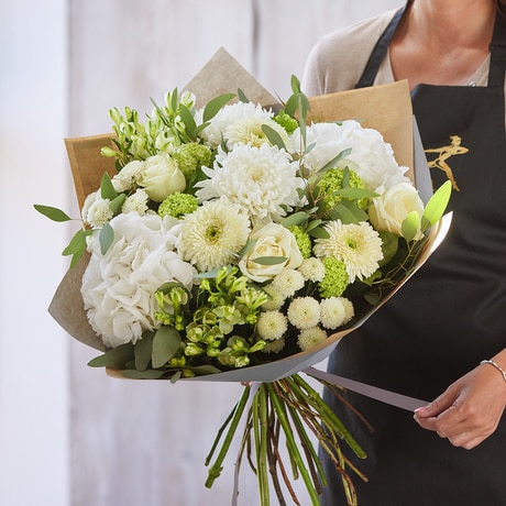 Sympathy hand-tied made with the finest flowers size,  inches height and  inches wide.