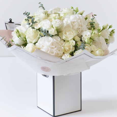 Showstopper White Flower Bouquet size,  inches height and  inches wide.
