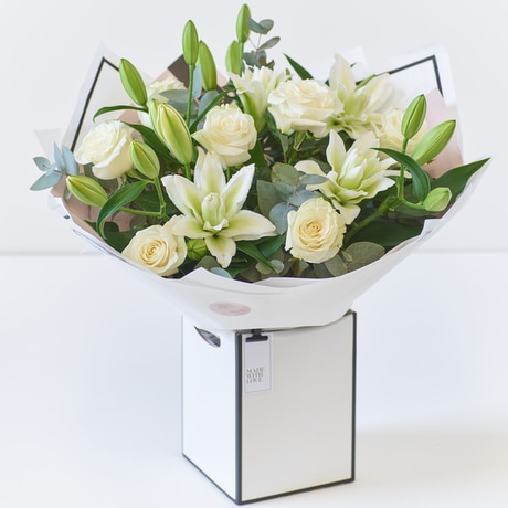Beautifully Simple Luxury White Rose and Lily Bouquet size,  inches height and  inches wide.