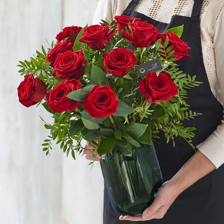 Valentine's Luxury Dozen Large-headed Red Roses with a vase size,  inches height and  inches wide.