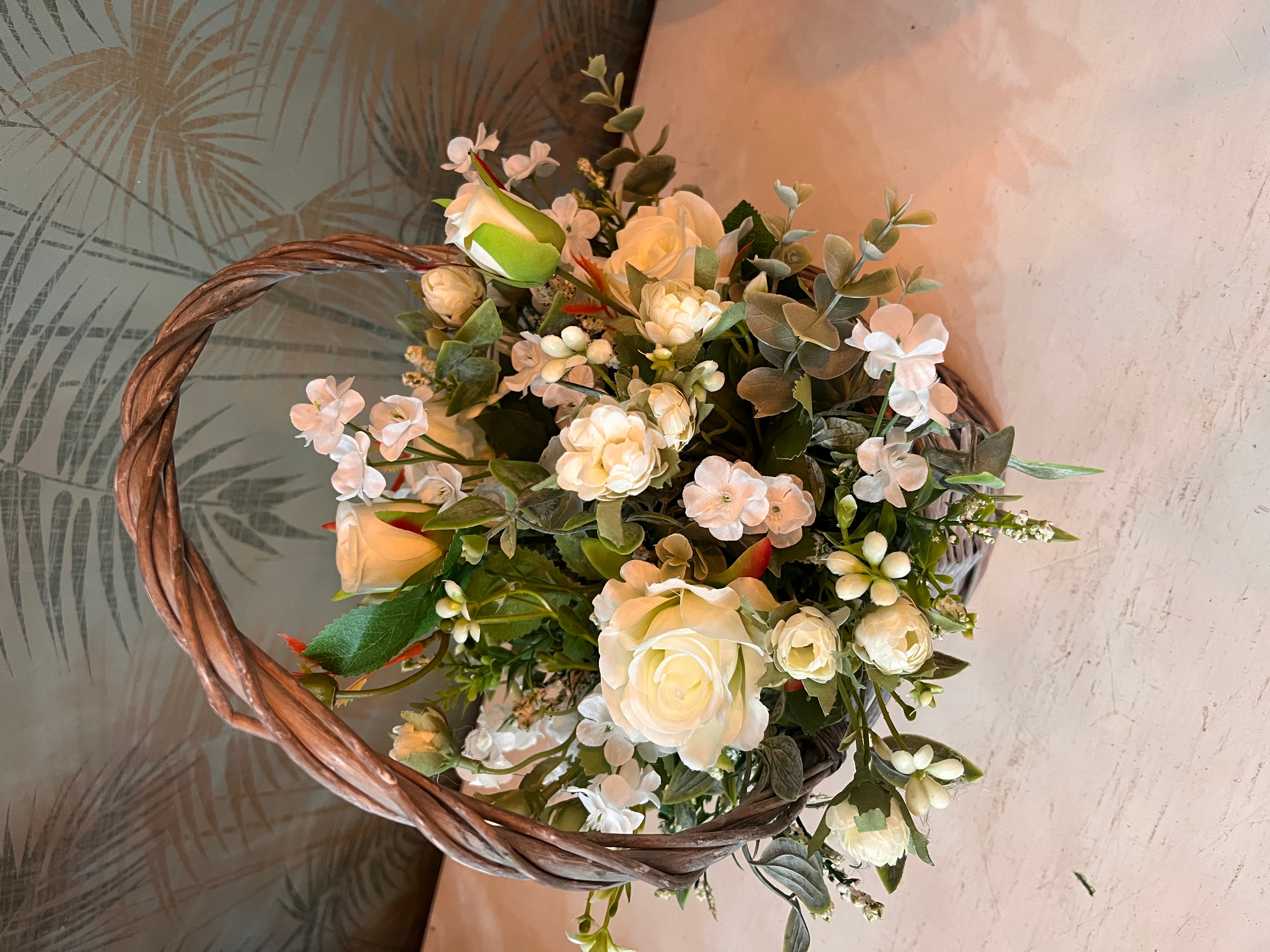 Artificial floral basket size,  inches height and  inches wide.