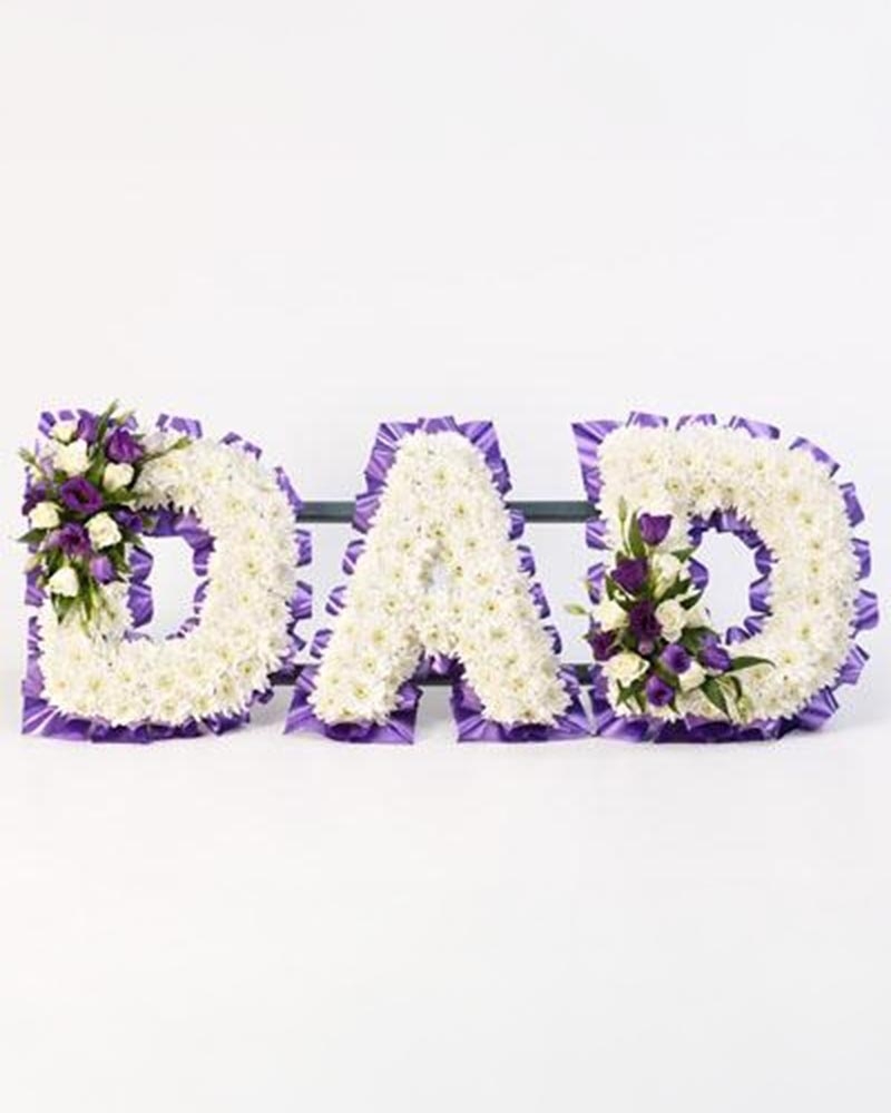 White Base Letter with Blue Ribbon and Spray Flower Arrangement