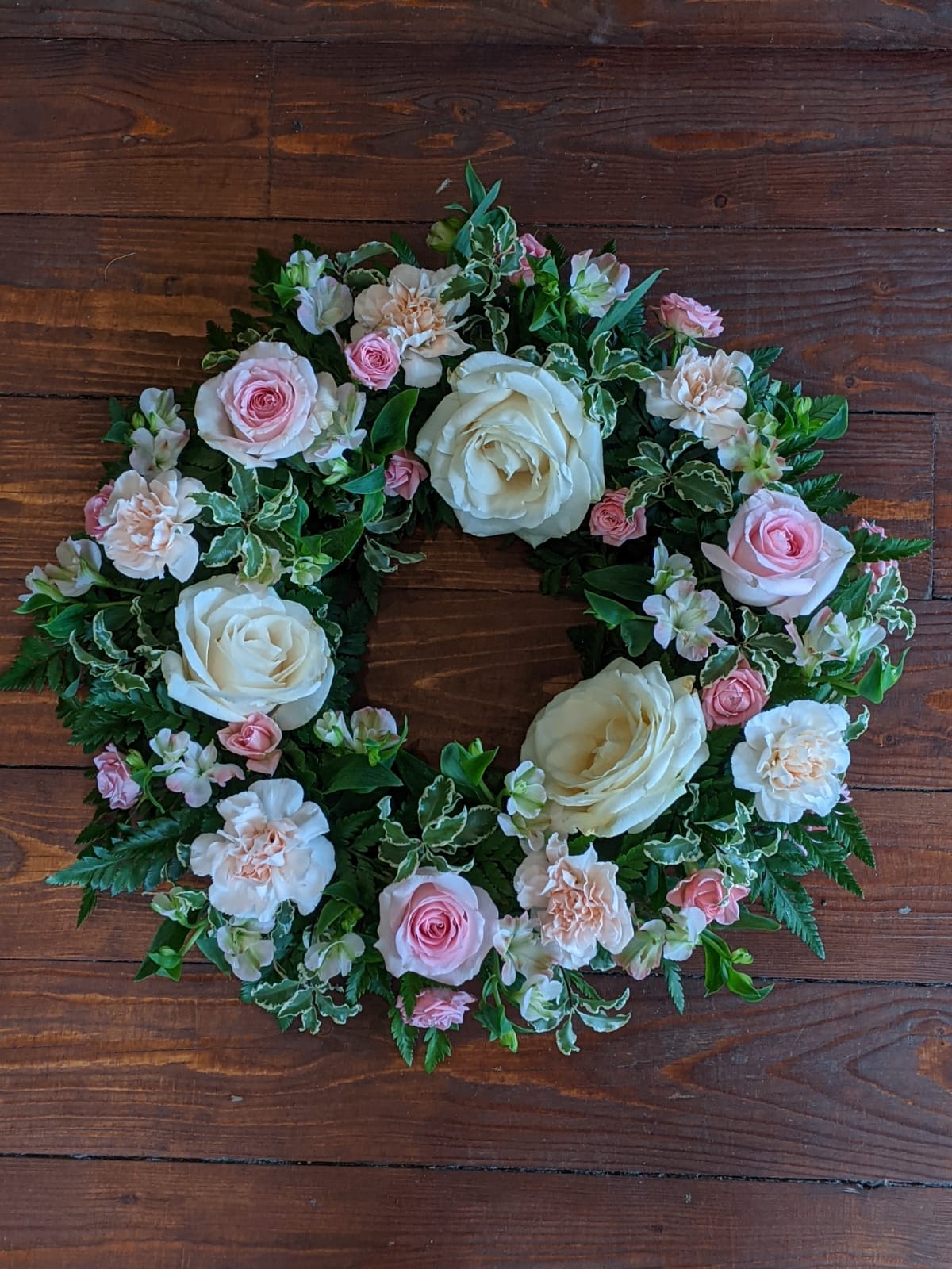 Pastel White and Pink Wreath Funeral Arrangement