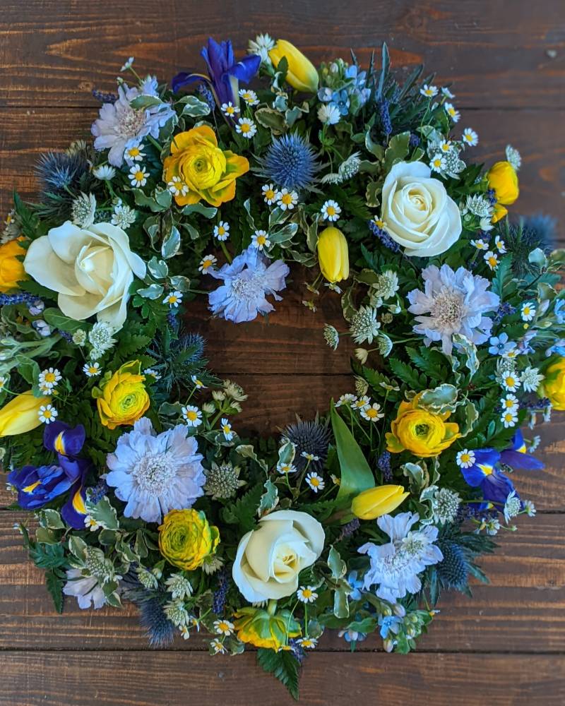 Yellow and Blue Wreath Funeral Arrangement