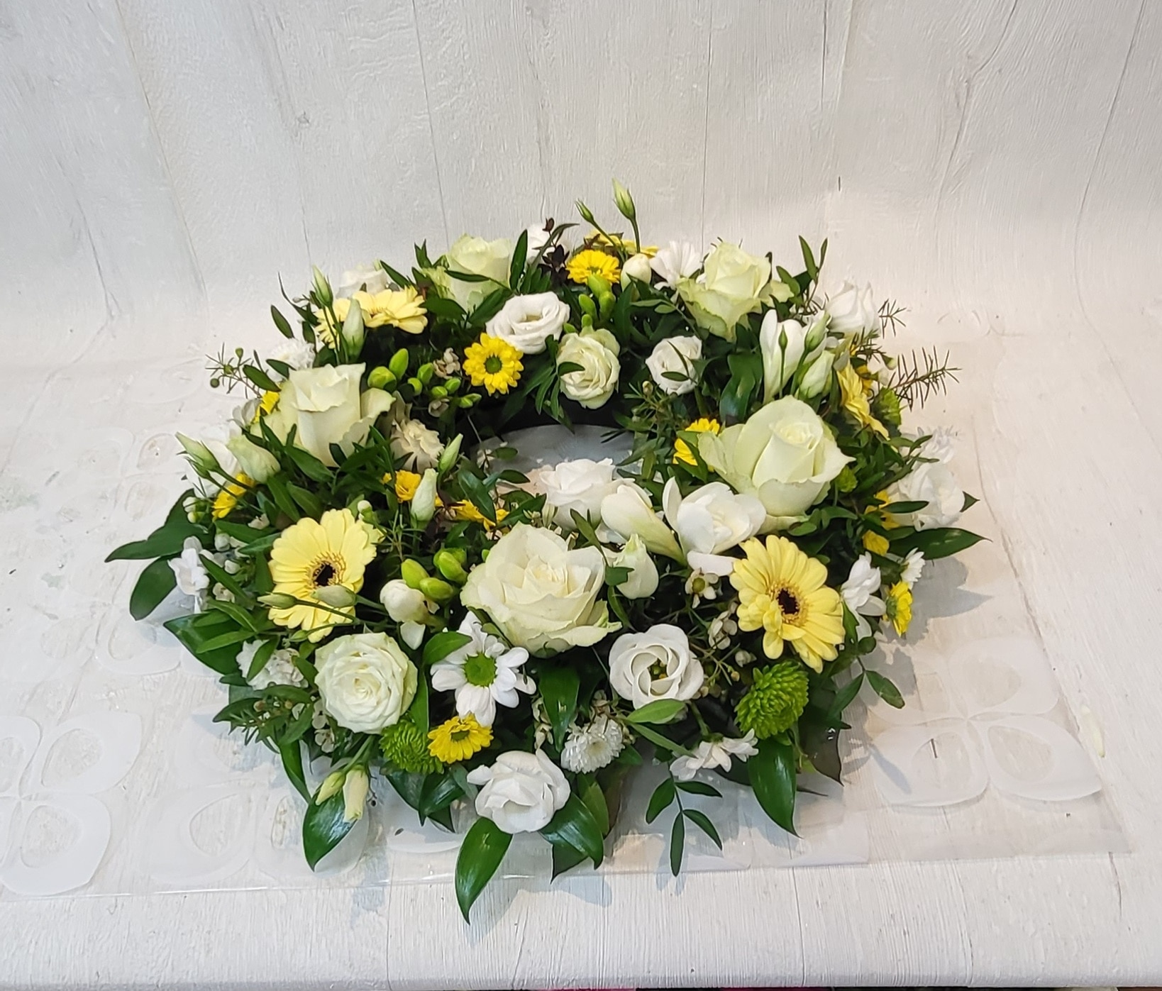 Loose Wreath Yellow and Cream Funeral Arrangement