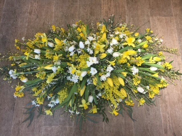 Yellow and white casket spray Funeral Arrangement